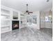 Gathering room with fireplace, built-in shelving, and pool view at 2077 Wembley Pl, Oviedo, FL 32765