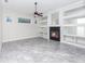 Gathering room with fireplace, built-in shelving and ceiling fan at 2077 Wembley Pl, Oviedo, FL 32765