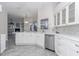 Bright white kitchen with stainless steel appliances and ample counter space at 2077 Wembley Pl, Oviedo, FL 32765
