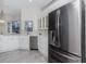 Modern kitchen featuring stainless steel appliances and white cabinetry at 2077 Wembley Pl, Oviedo, FL 32765