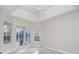 Main bedroom with vaulted ceiling, ceiling fan and sliding doors to the pool at 2077 Wembley Pl, Oviedo, FL 32765