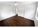 Well-lit bedroom featuring wood floors and white walls at 2111 Staunton Ave, Winter Park, FL 32789