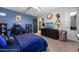 Bedroom with a modern desk setup and blue bedding at 2323 Nuthatch St, St Cloud, FL 34771