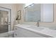 Modern bathroom with white vanity, quartz countertop, and a large mirror at 2397 River Tree Cir, Sanford, FL 32771