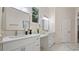 Spacious bathroom with double vanity, quartz countertops and marble flooring at 2397 River Tree Cir, Sanford, FL 32771