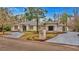 Attractive single-story home with landscaped yard and circular driveway at 2397 River Tree Cir, Sanford, FL 32771