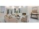 Cozy living room boasts a fireplace, large windows, and elegant furnishings at 2397 River Tree Cir, Sanford, FL 32771