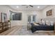 Spacious main bedroom with a king-size bed and access to the pool area at 2397 River Tree Cir, Sanford, FL 32771
