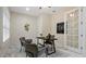 Bright home office with a wooden desk, two chairs, and a world map on the wall at 2397 River Tree Cir, Sanford, FL 32771