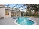 Relaxing freeform pool with a covered patio at 2397 River Tree Cir, Sanford, FL 32771