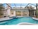Inviting pool area with covered lanai, spa, and ample deck space at 2397 River Tree Cir, Sanford, FL 32771