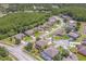 Aerial view of a residential neighborhood with houses and a pond at 2625 Brompton Ct, Orlando, FL 32833