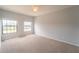 Spacious bedroom with two large windows and neutral decor at 2625 Brompton Ct, Orlando, FL 32833