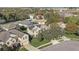 Aerial view of house and neighborhood with solar panels at 264 Wallrock Ct, Ocoee, FL 34761
