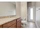 Bathroom showcasing granite countertops, a toilet, and a door to the shower area at 264 Wallrock Ct, Ocoee, FL 34761