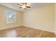 Bedroom with ceiling fan and wood-look flooring at 264 Wallrock Ct, Ocoee, FL 34761