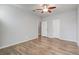 Spacious bedroom with ceiling fan and wood-look floors at 264 Wallrock Ct, Ocoee, FL 34761