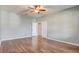 Bedroom boasts wood-look flooring and a doorway leading to other rooms at 264 Wallrock Ct, Ocoee, FL 34761