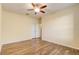 Bright bedroom with double doors and ceiling fan at 264 Wallrock Ct, Ocoee, FL 34761