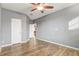 Bedroom showcases wood-look flooring and a doorway to the hallway at 264 Wallrock Ct, Ocoee, FL 34761