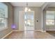 Bright dining room with tiled floors and a sliding door leading to the backyard, providing an inviting indoor-outdoor flow at 264 Wallrock Ct, Ocoee, FL 34761