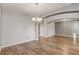 Spacious dining area with hardwood floors and neutral walls at 264 Wallrock Ct, Ocoee, FL 34761
