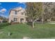 Beautiful two-story home with lush green lawn, enhanced by mature trees, offering a serene and inviting curb appeal at 264 Wallrock Ct, Ocoee, FL 34761