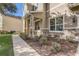 Landscaped walkway leading to a charming house entrance at 264 Wallrock Ct, Ocoee, FL 34761