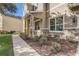 Inviting front yard landscaping with stone accents and meticulously maintained shrubbery framing the home's entrance at 264 Wallrock Ct, Ocoee, FL 34761