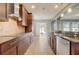 Bright kitchen boasts granite countertops and stainless steel appliances at 264 Wallrock Ct, Ocoee, FL 34761