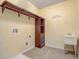 Laundry room with shelving, rod, and utility sink at 264 Wallrock Ct, Ocoee, FL 34761