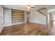 Bright living room with a modern accent wall, hardwood floors, and an open layout, perfect for entertaining at 264 Wallrock Ct, Ocoee, FL 34761