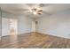 Main bedroom with wood floors and ensuite bathroom at 264 Wallrock Ct, Ocoee, FL 34761