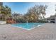 Community pool with gazebo and surrounding patio at 264 Wallrock Ct, Ocoee, FL 34761