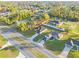 Aerial view of the property showcasing the home, surrounding neighborhood, and spacious lot at 265 Marion Oaks Mnr, Ocala, FL 34473