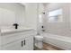 Modern bathroom with white vanity, quartz countertop, and tiled shower/tub combo at 265 Marion Oaks Mnr, Ocala, FL 34473