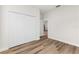 Bedroom with wood-look floors and a large closet at 265 Marion Oaks Mnr, Ocala, FL 34473