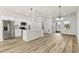 Spacious living room boasts an open layout, stainless appliances, and natural light at 265 Marion Oaks Mnr, Ocala, FL 34473