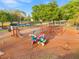 Community playground features swings, slides, and climbing structures for children to enjoy in an outdoor setting at 265 Marion Oaks Mnr, Ocala, FL 34473
