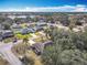 Aerial view of neighborhood showcasing houses near a lake at 2810 Summerfield St, Deltona, FL 32738