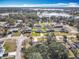 Aerial view of a neighborhood featuring houses and a lake at 2810 Summerfield St, Deltona, FL 32738