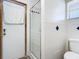 Clean bathroom with shower stall, toilet and white tiled walls at 2810 Summerfield St, Deltona, FL 32738