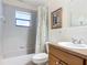 Clean bathroom with tub, shower, and wood vanity at 2810 Summerfield St, Deltona, FL 32738