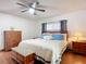 Main bedroom with wooden furniture and en-suite bathroom at 2810 Summerfield St, Deltona, FL 32738