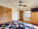 Bedroom with queen bed, wooden wardrobe and ceiling fan at 2810 Summerfield St, Deltona, FL 32738