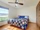 Bright bedroom featuring a queen-size bed and ample closet space at 2810 Summerfield St, Deltona, FL 32738