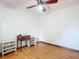 Bedroom featuring laminate floors, ceiling fan, and simple decor at 2810 Summerfield St, Deltona, FL 32738