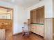 Home office features built-in cabinets and rocking chair at 2810 Summerfield St, Deltona, FL 32738