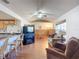 Open concept kitchen and living area with hardwood floors at 2810 Summerfield St, Deltona, FL 32738
