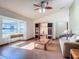 Living room with laminate flooring, a sofa, and built-in shelving at 2810 Summerfield St, Deltona, FL 32738